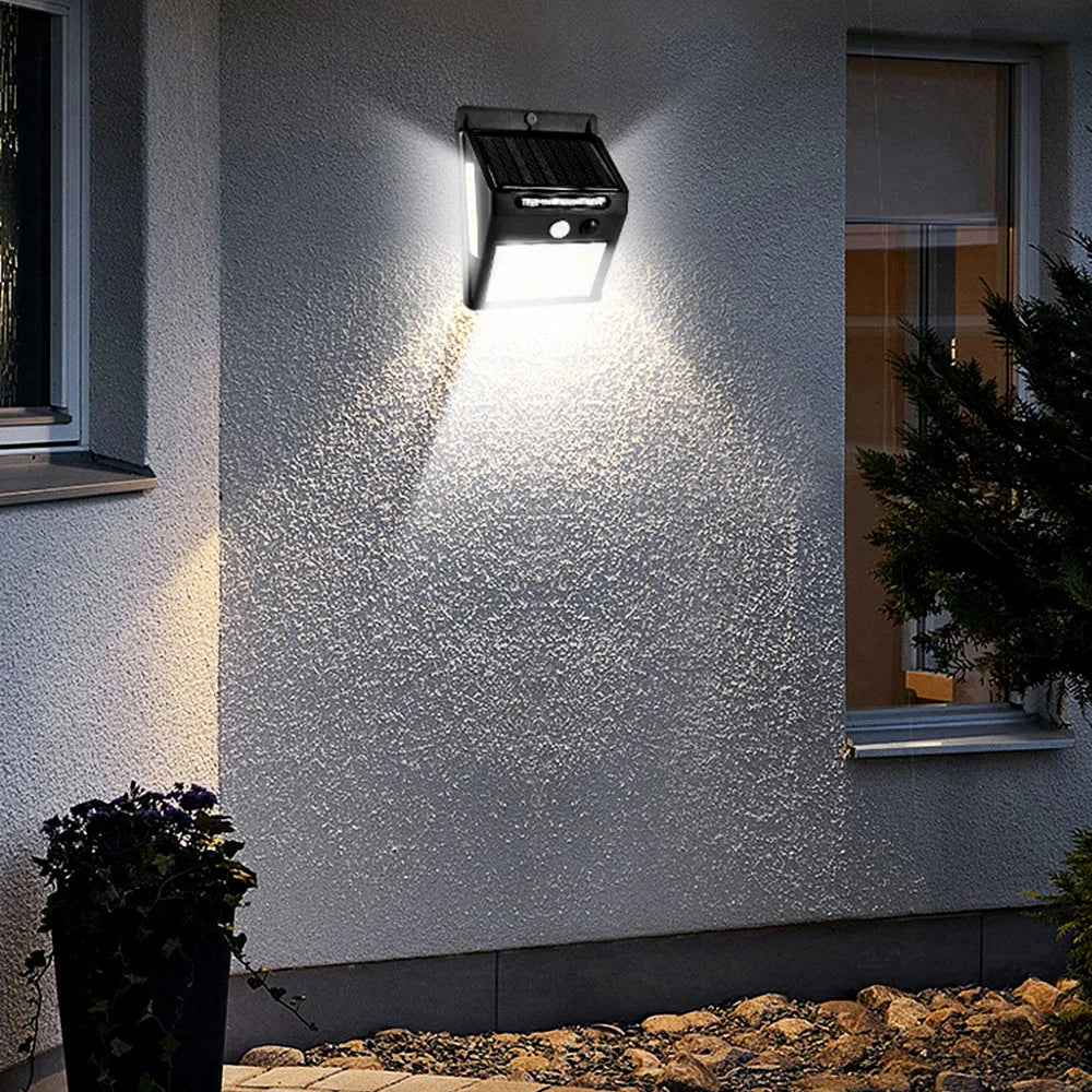 3sided 140LED PIR Motion Sensor Sunlight, Smart solar-powered street lamp with motion sensor, recharging at dusk.