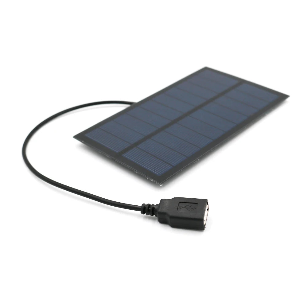 Solar-powered charger for small devices, providing 5V/7W of energy, ideal for outdoor use.