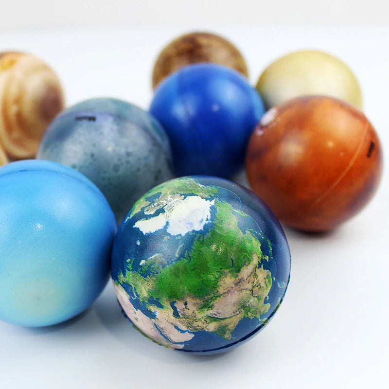 Stress-relieving toy features eight planetary balls promoting educational decompression.