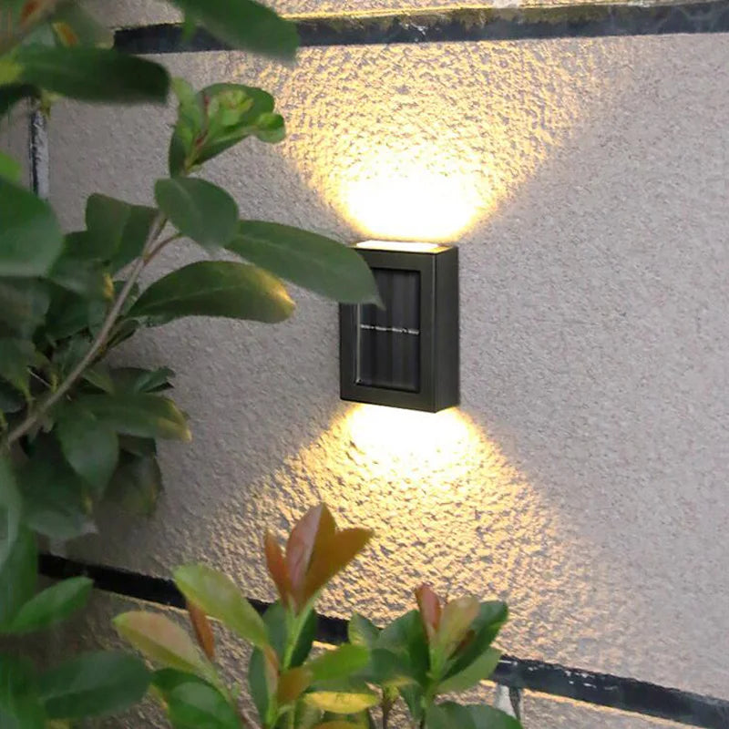 Solar-powered LED wall lamp for outdoor use, perfect for gardens, terraces, balconies and streets.