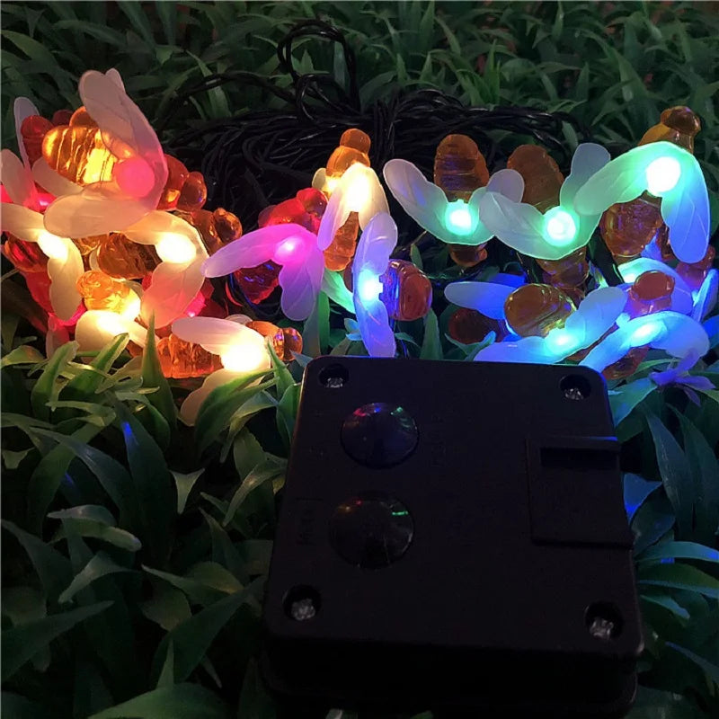 Solar-powered LED string light with built-in sensor; charges during day, turns on at night, energy-saving and eco-friendly.