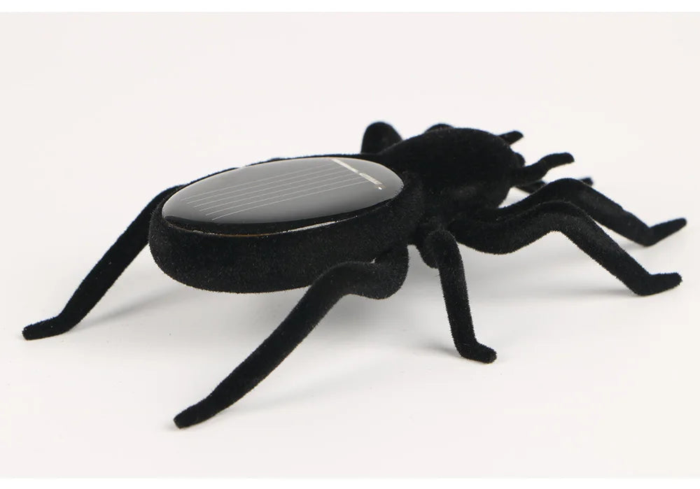 Eco-friendly robotic tarantula toy runs on solar power, suitable for kids and adults.