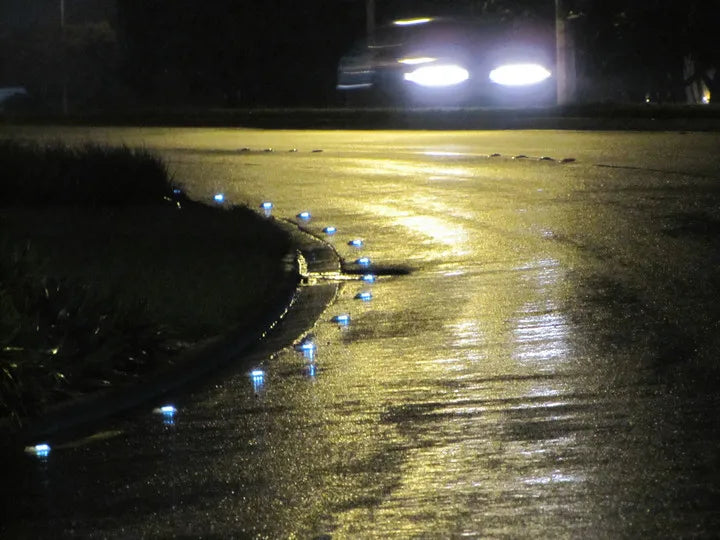 Solar-powered road stud maker with LED light for pathway and dock applications.