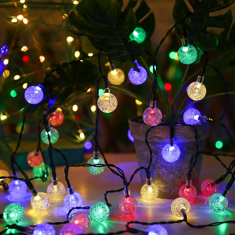 Outdoor decoration string featuring LEDs, crystals, and solar-powered lights for streets, gardens, or Christmas trees.