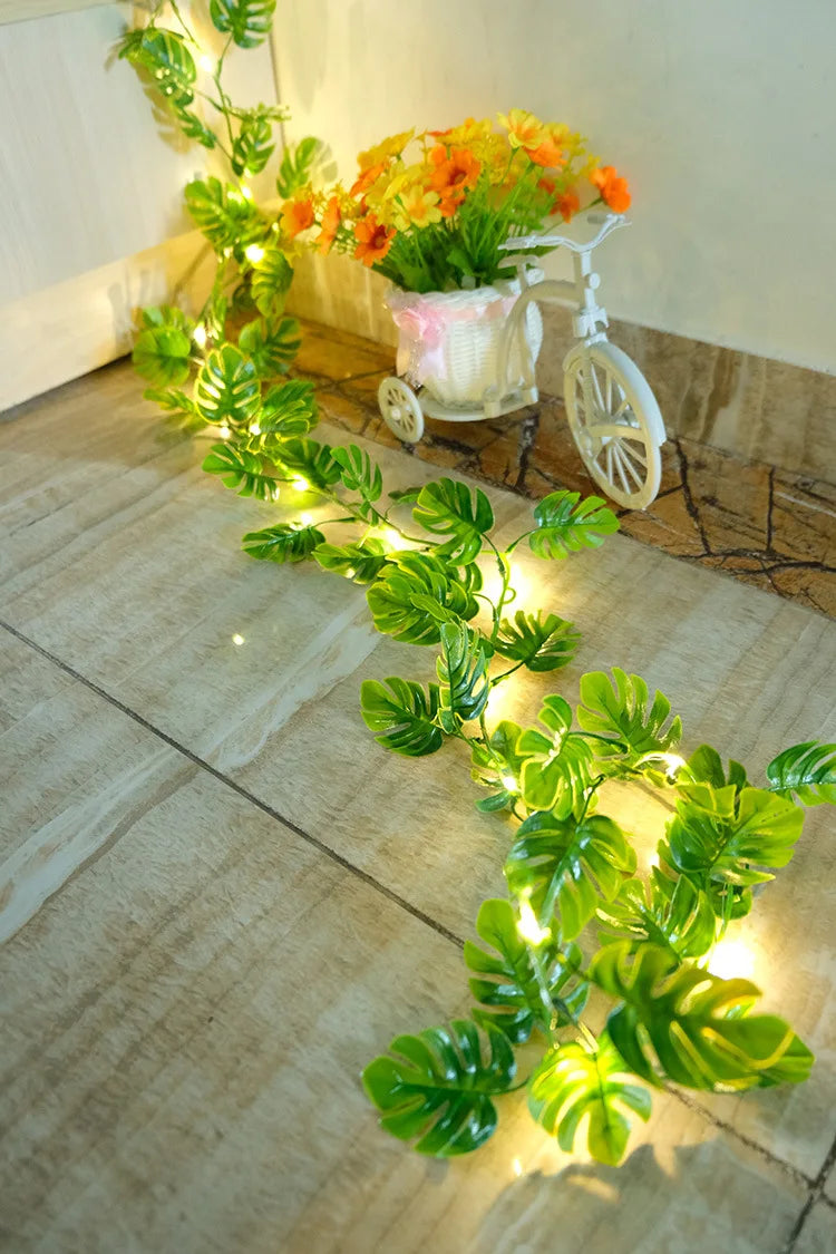 Elegant solar-powered garland with copper LED fairy lights, perfect for outdoor gardens and floral arrangements.