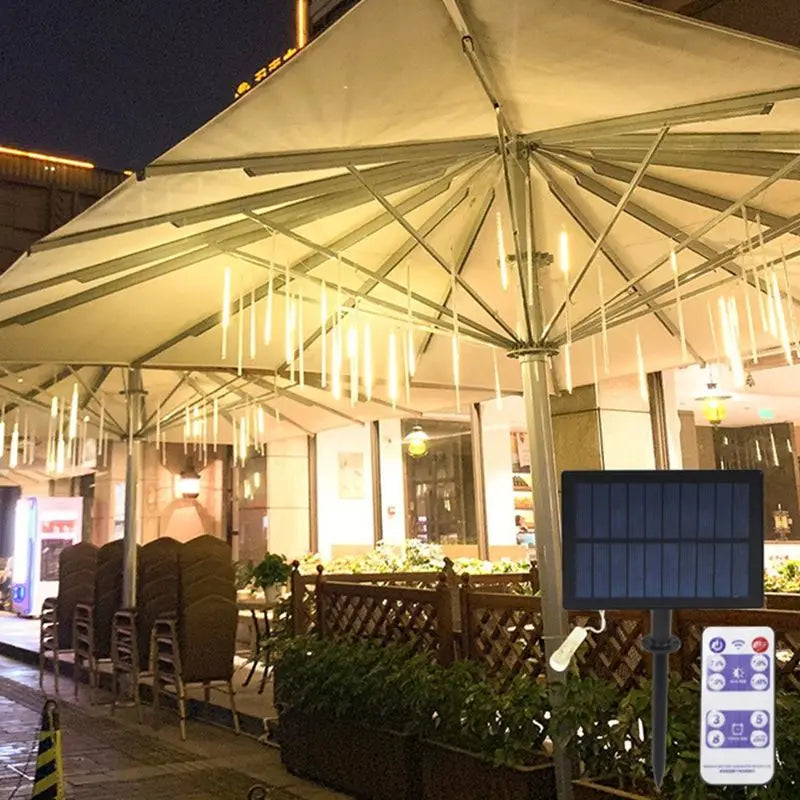 Solar Led Light, Solar-powered meteor shower light string with LED bulbs, IP65 protection, and rechargeable battery.