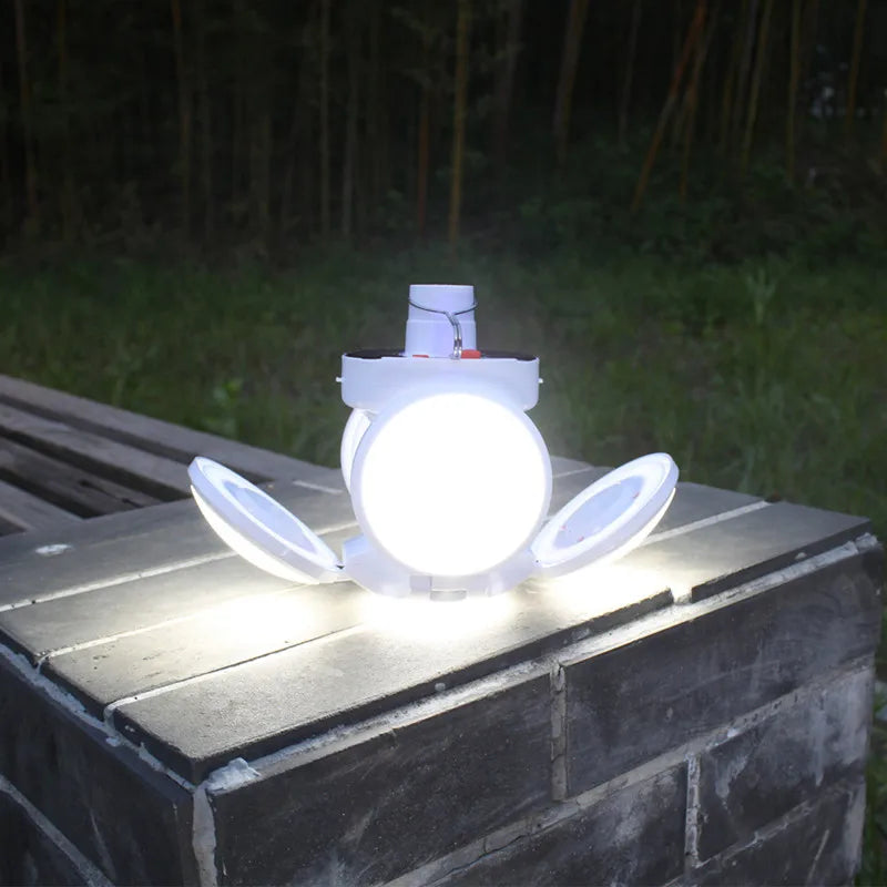 Waterproof solar light bulb with hook for outdoor use in gardens, courtyards, and emergency situations.