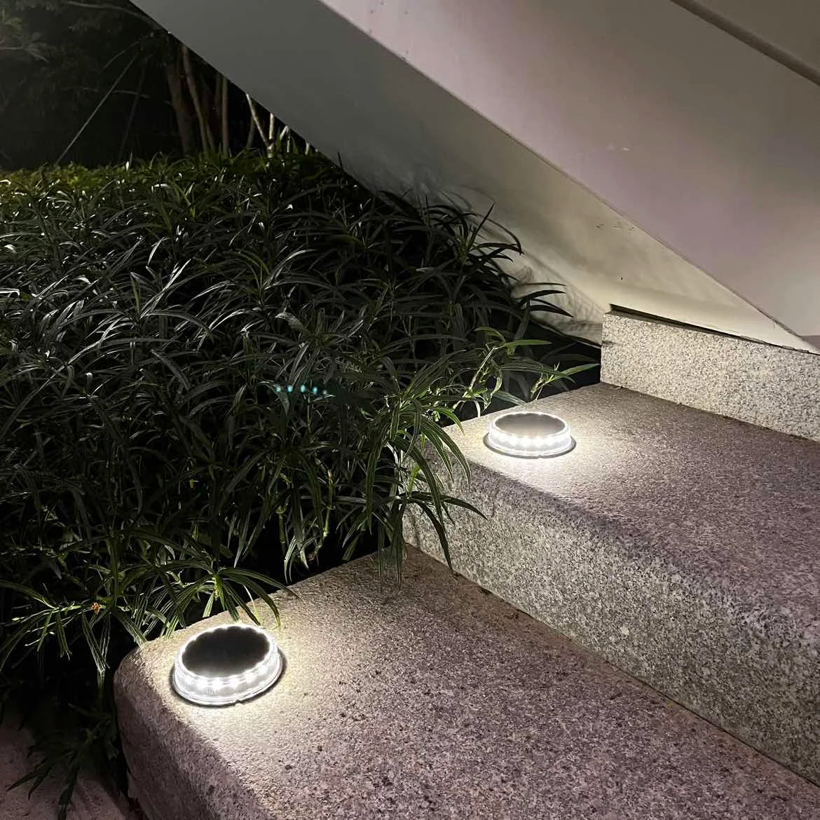 4Pack Solar Ground Light, Softly lights pathways for safety and ambiance.