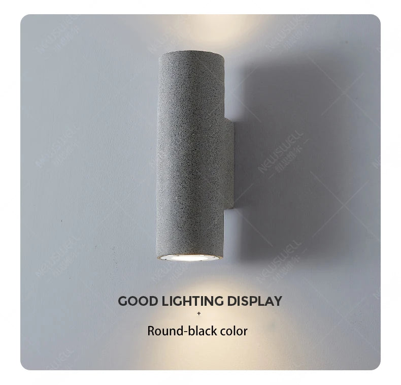 Round black lamp with sleek design provides excellent lighting.