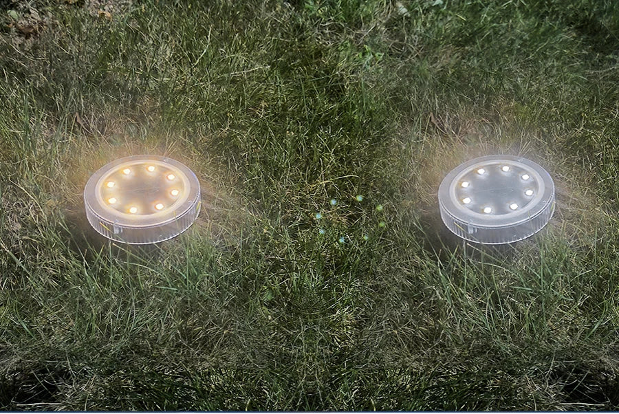 Solar Powered Ground Light, Solar-powered path lights charge during the day, shining bright at night for up to 12 hours.