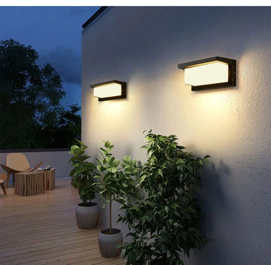 Warranty-backed wall lamp with LED light source and brushed nickel finish, suitable for outdoor use.