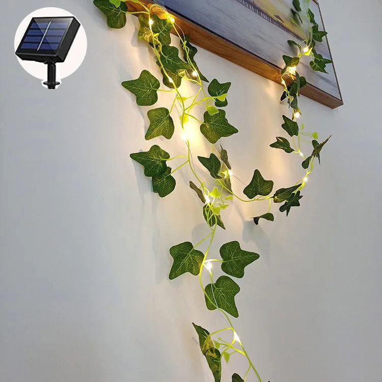 Solar-powered lamp with lithium battery, incandescent bulbs, and green ivy leaf design, suitable for outdoor use.