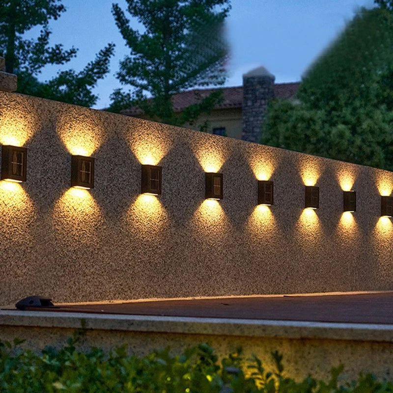 Solar-powered wall lamps with LEDs light up outdoor spaces, perfect for fences, decks, paths, and patios.