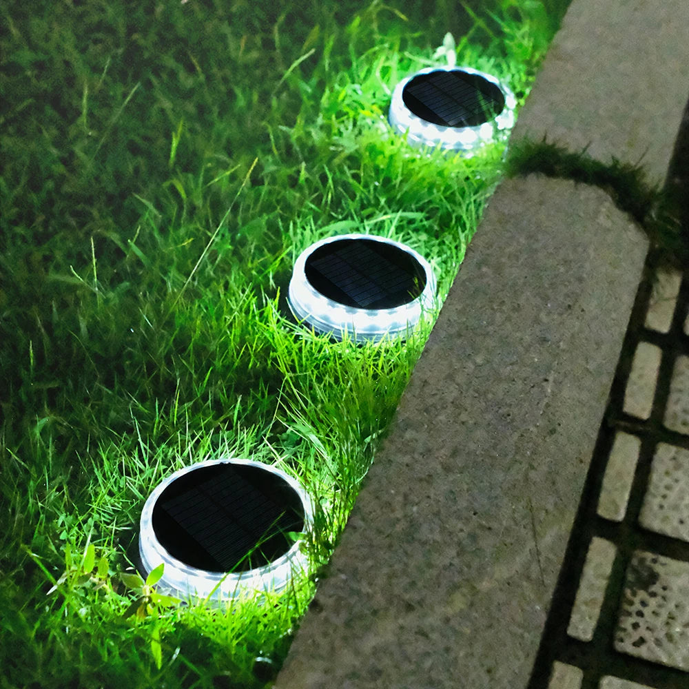 4Pack Solar Ground Light, Solar-powered ground lights with 17 LEDs for outdoor use, waterproof, and perfect for lawns, paths, patios, and landscaping.