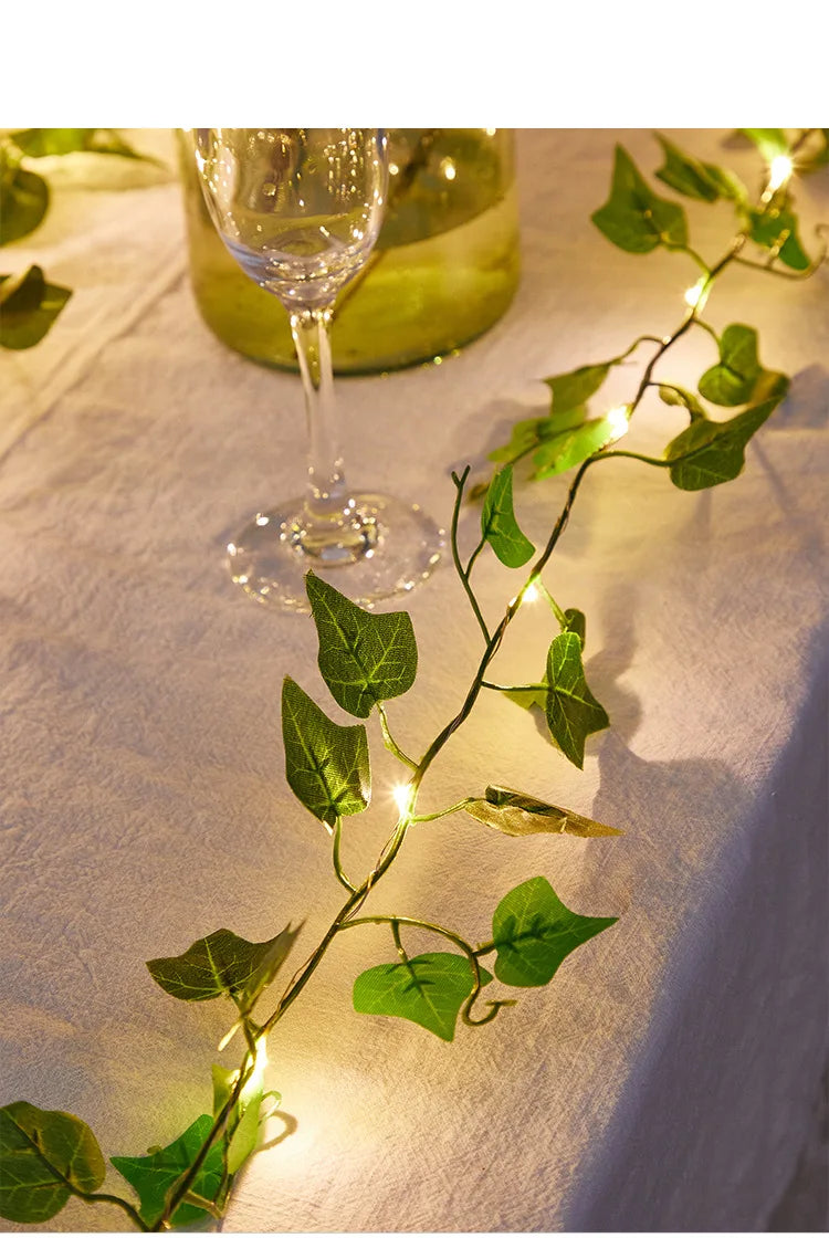 Solar-powered cottage lamp with green ivy leaf design, lithium battery, and incandescent bulbs.